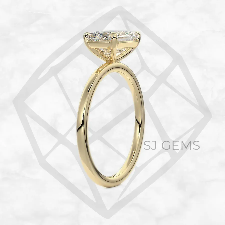 east west | emerald with 9k yellow gold metal and  shape diamond