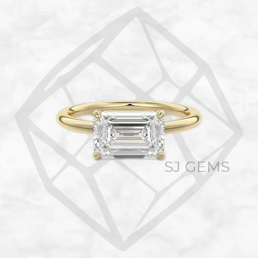 the cradle | emerald with 9k yellow gold metal and  shape diamond
