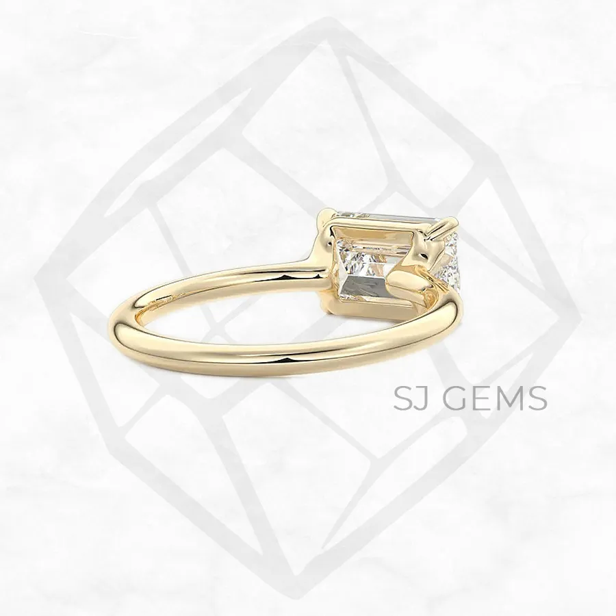 the cradle | emerald with 9k yellow gold metal and  shape diamond